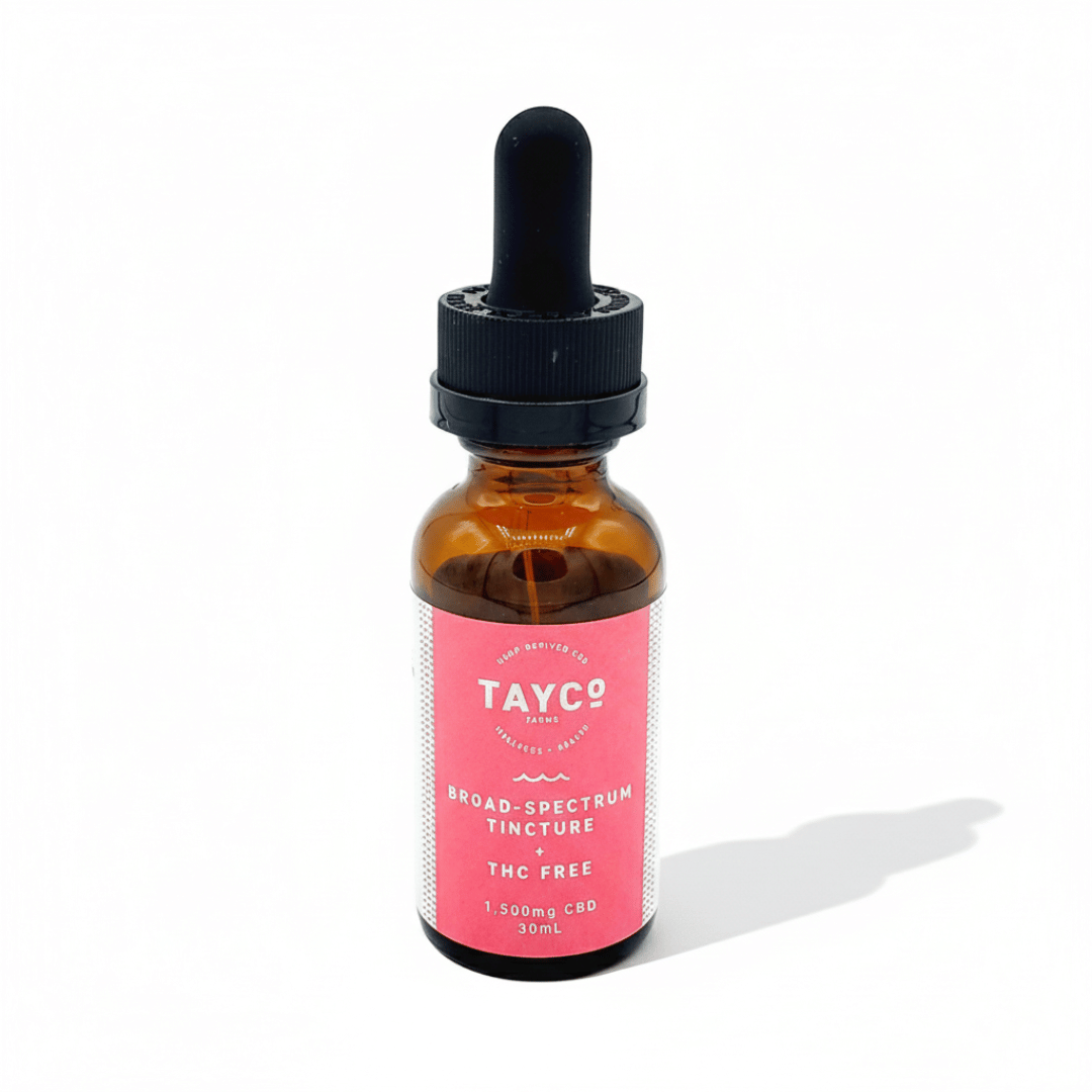 Bottle of Tayco broad-spectrum tincture with a pink label on a white background
