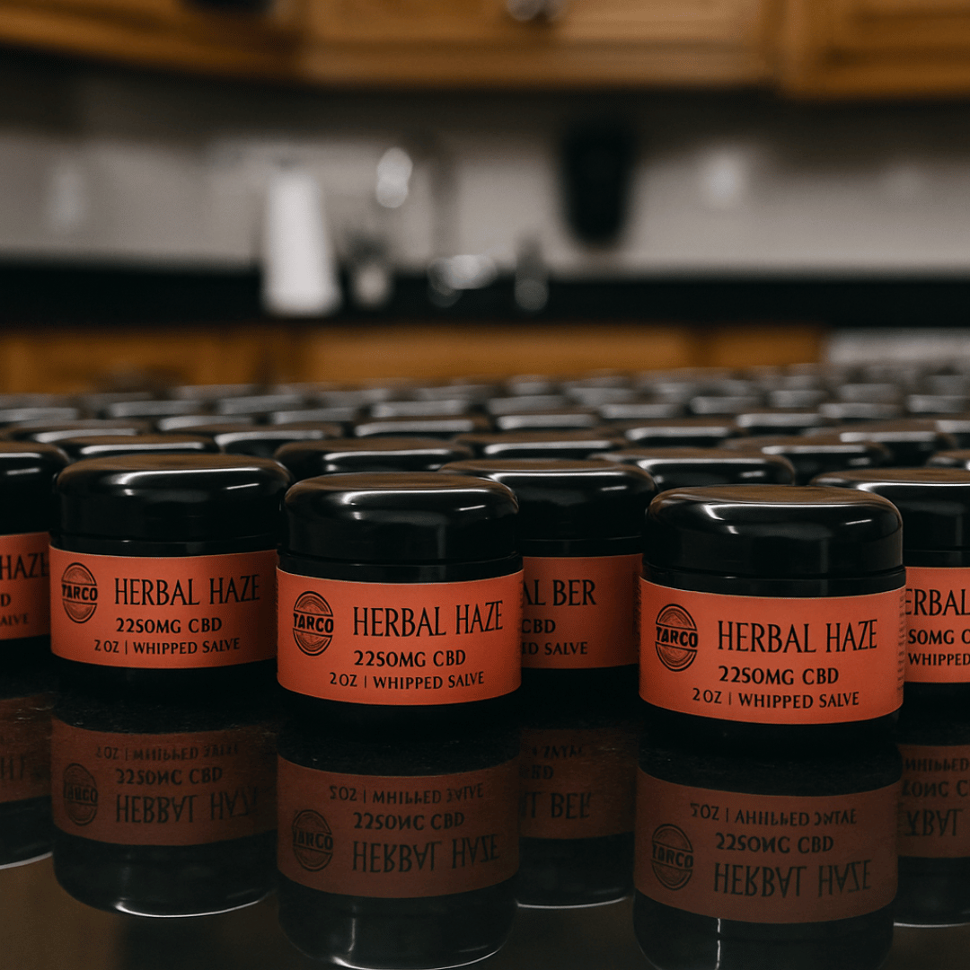 Multiple jars of 'Herbal Haze' with orange labels on a reflective surface.