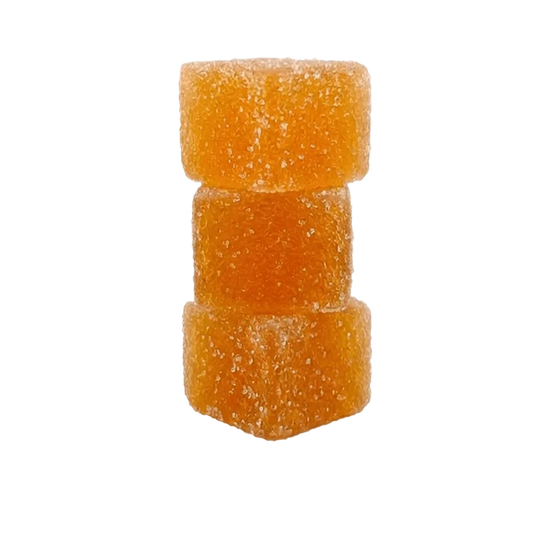 Mood orange Mighty Mango gummies stacked on white