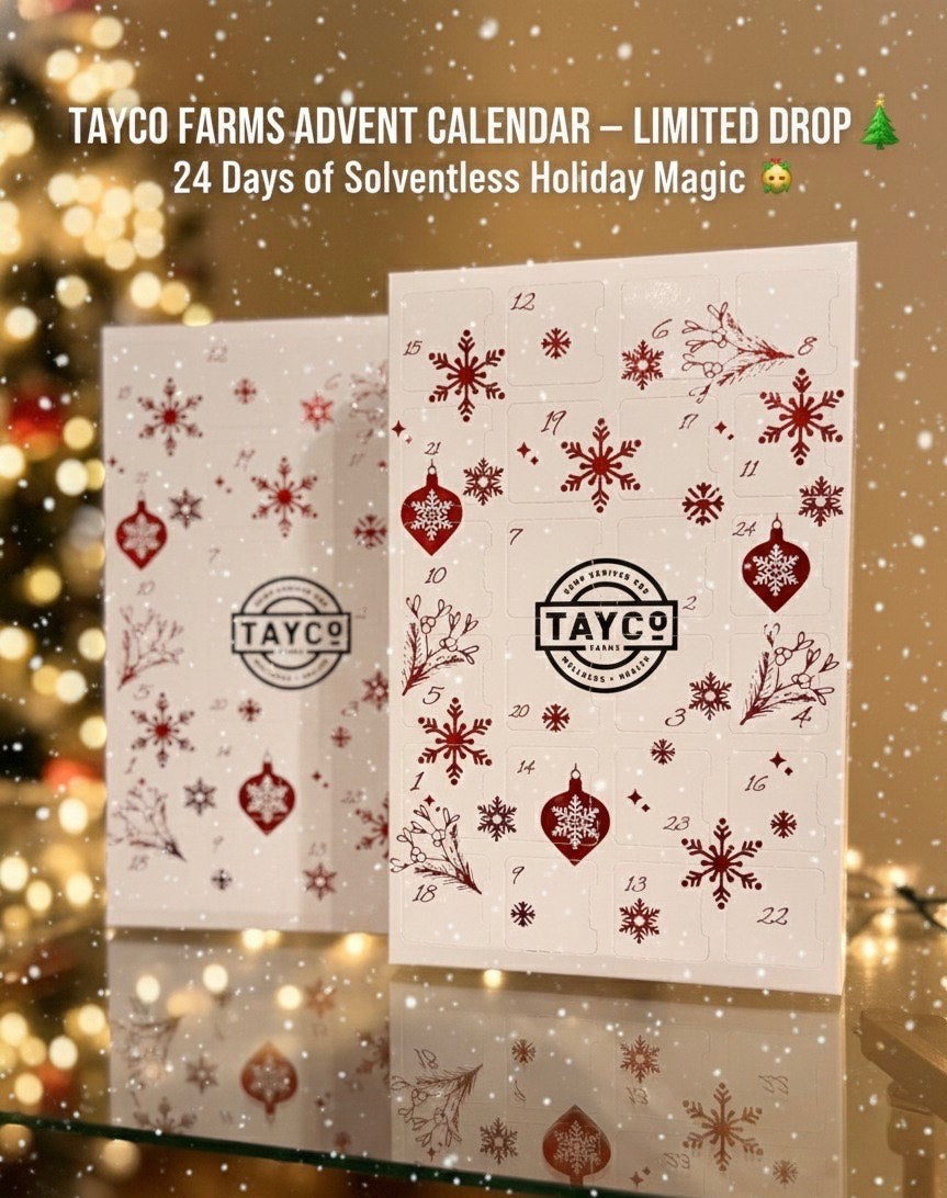 Tayco Farms Advent Calendar with festive red snowflake design displayed in front of a blurred holiday background with warm lights.