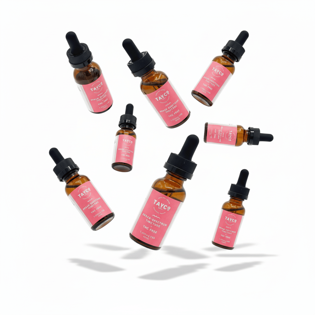 Tayco Farms broad spectrum CBD tincture bottles in a floating arrangement