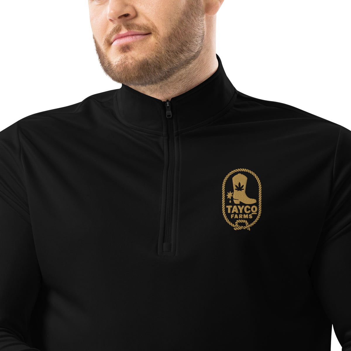 Clothing detail of a black Tayco Farms Adidas quarter-zip pullover