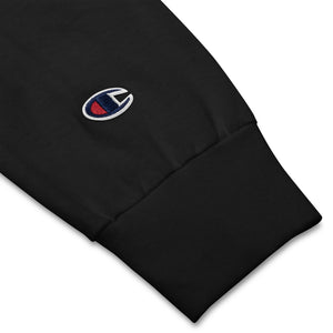 Clothing detail of a black Tayco Farms cowboy Champion long sleeve shirt