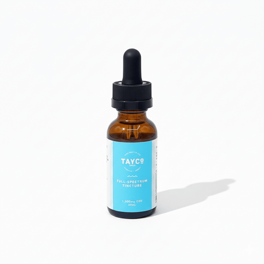 Brown glass bottle with dropper labeled 'TAYCO' on a white background