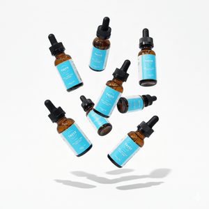 Tayco Farms full spectrum CBD tincture bottles in a floating arrangement