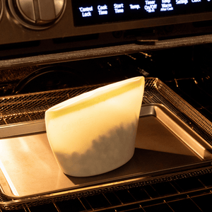 Infusion pouch in a container on an oven tray