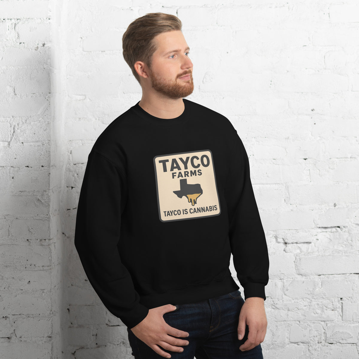 Man wearing a black Tayco Farms Texas Drip sweatshirt