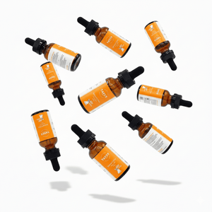 Spencer's Elixir CBD pet tincture bottles in a floating arrangement
