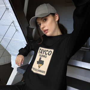 Woman wearing a black Tayco Farms Texas Drip sweatshirt
