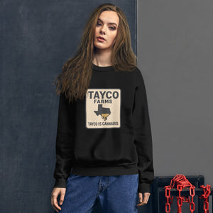 Woman wearing a black Tayco Farms Texas Drip sweatshirt
